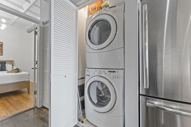1307 S Wabash Ave Unit 413, Chicago, IL 60605 - laundry area with stacked washer / dryer and dark wood finished floors