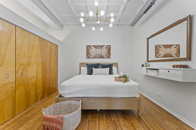 1307 S Wabash Ave Unit 413, Chicago, IL 60605 - bedroom with a chandelier, coffered ceiling, and hardwood / wood-style floors