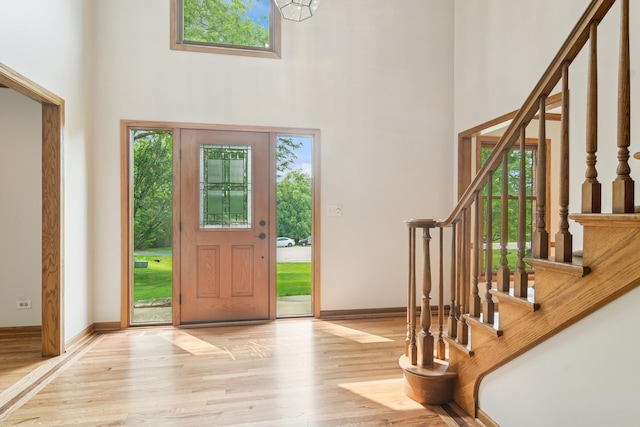6513 High Meadow Ct, Long Grove, IL 60047 - entryway featuring a high ceiling, wood finished floors, and stairs