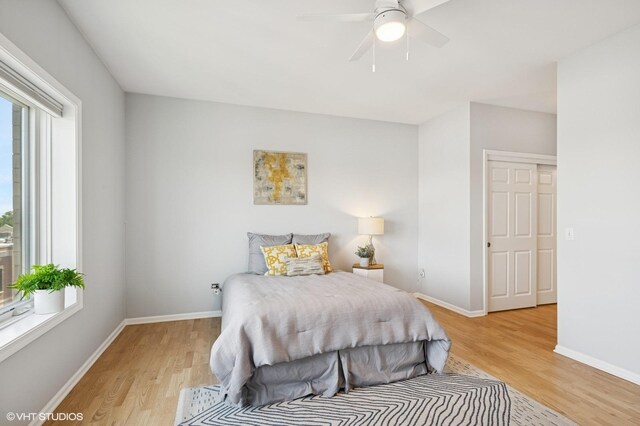 11 S Wille St Unit 709, Mount Prospect, IL 60056 - bedroom with light wood-style floors and a ceiling fan