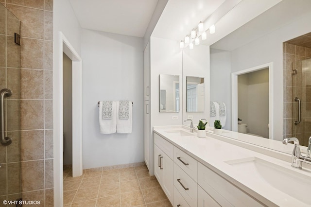 11 S Wille St Unit 709, Mount Prospect, IL 60056 - bathroom with double vanity, a shower stall, and tile patterned floors