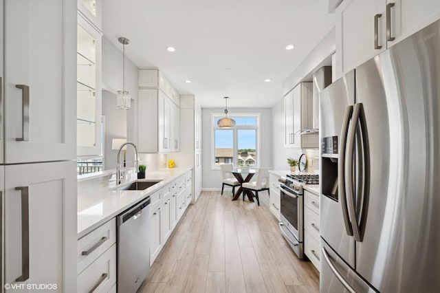 11 S Wille St Unit 709, Mount Prospect, IL 60056 - kitchen featuring appliances with stainless steel finishes, white cabinetry, light countertops, light wood-style floors, and recessed lighting