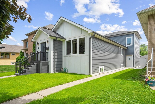 2563 Maple St, River Grove, IL 60171 - view of front of home featuring board and batten siding and a front yard