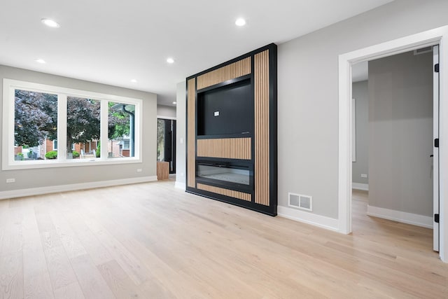 2563 Maple St, River Grove, IL 60171 - unfurnished living room featuring light wood finished floors and recessed lighting