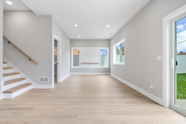 2563 Maple St, River Grove, IL 60171 - spare room featuring light wood-style floors, plenty of natural light, stairs, and recessed lighting