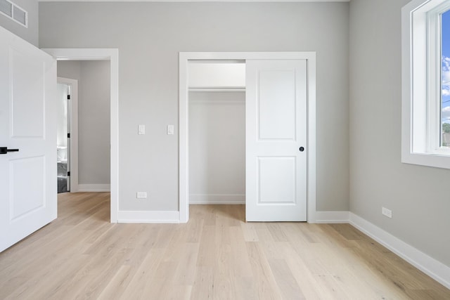 2563 Maple St, River Grove, IL 60171 - unfurnished bedroom featuring light wood-style floors and a closet