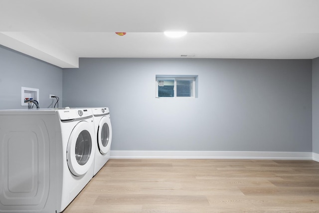 2563 Maple St, River Grove, IL 60171 - laundry room featuring washing machine and dryer and light wood finished floors