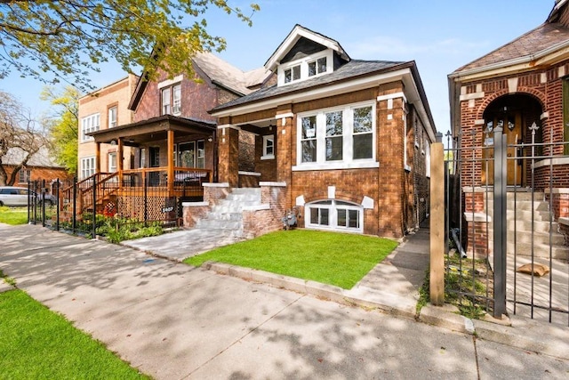 5407 S Justine St, Chicago, IL 60609 - view of front of house with brick siding, a porch, and a front yard