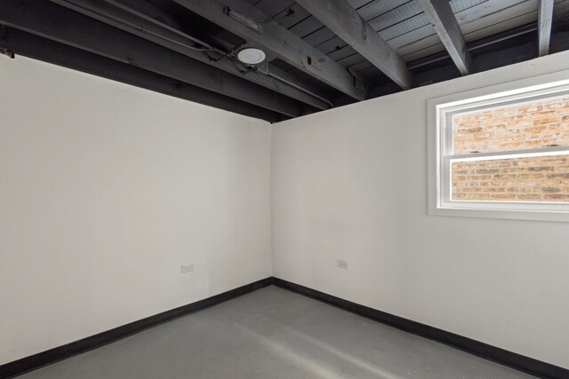 5407 S Justine St, Chicago, IL 60609 - empty room featuring finished concrete floors and baseboards