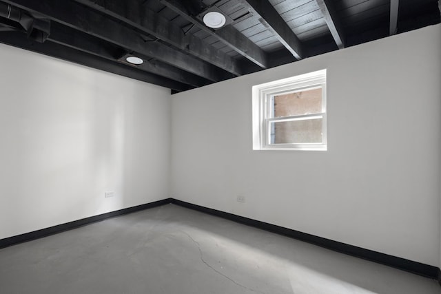 5407 S Justine St, Chicago, IL 60609 - unfurnished room featuring finished concrete floors and a wood ceiling with exposed beams