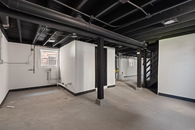 5407 S Justine St, Chicago, IL 60609 - below grade area featuring baseboards and stairway