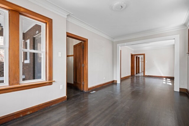 5407 S Justine St, Chicago, IL 60609 - empty room featuring dark wood-style flooring and crown molding
