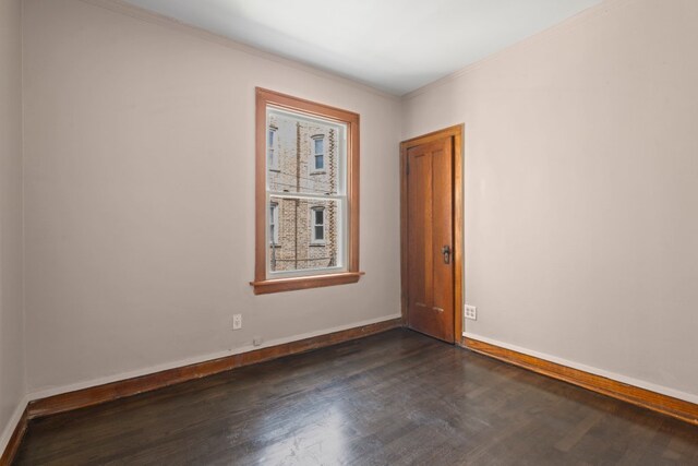 5407 S Justine St, Chicago, IL 60609 - spare room with dark wood-style floors and crown molding