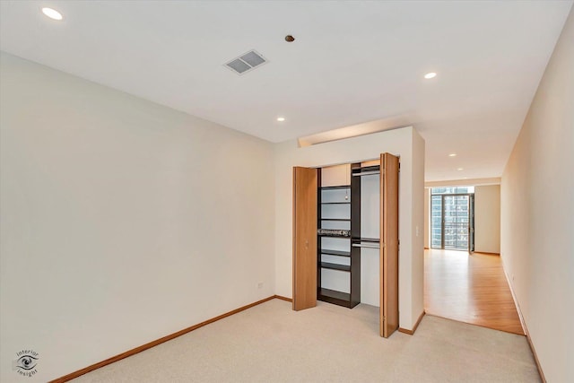 910 S Michigan Ave Unit 1712, Chicago, IL 60605 - unfurnished bedroom with light colored carpet, recessed lighting, and a closet
