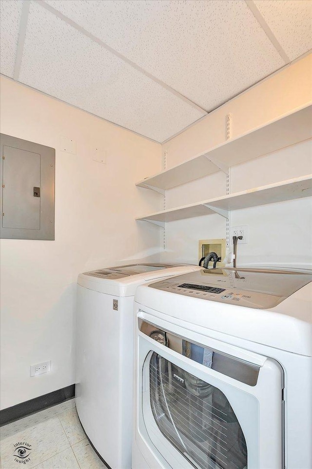 910 S Michigan Ave Unit 1712, Chicago, IL 60605 - washroom featuring electric panel, washer and clothes dryer, and light tile patterned flooring