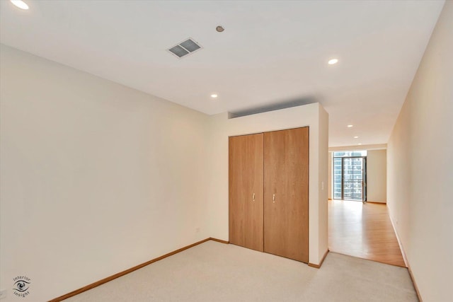 910 S Michigan Ave Unit 1712, Chicago, IL 60605 - unfurnished bedroom with recessed lighting, light colored carpet, and a closet