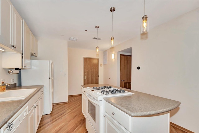 910 S Michigan Ave Unit 1712, Chicago, IL 60605 - kitchen with white appliances, light wood finished floors, a center island, and white cabinetry