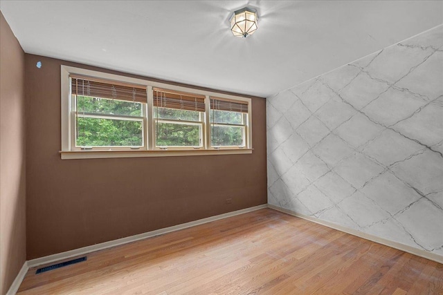 1719 Ferndale Ave, Northbrook, IL 60062 - spare room featuring light wood-style floors and baseboards