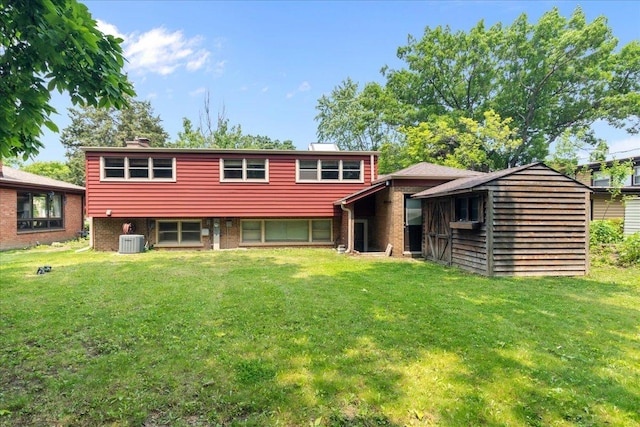 1719 Ferndale Ave, Northbrook, IL 60062 - rear view of property with a yard, brick siding, and a chimney