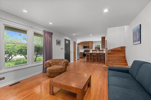 1719 Ferndale Ave, Northbrook, IL 60062 - living room featuring recessed lighting, light wood-style flooring, and stairs