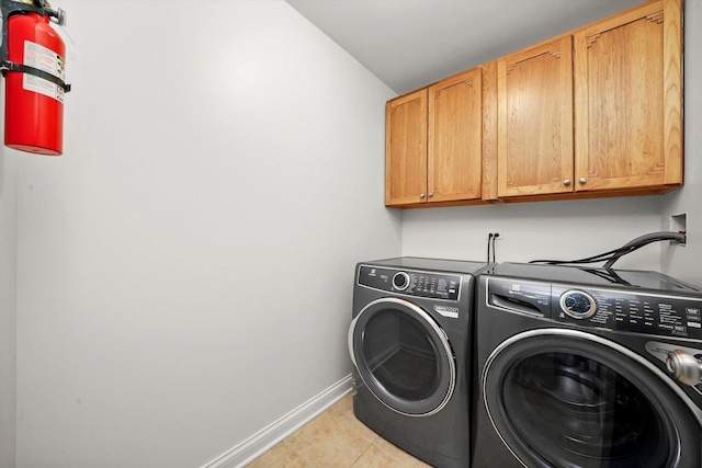 5227 Cobblers Xing Unit 5227, Mchenry, IL 60050 - laundry area with cabinet space, washer and dryer, and light tile patterned floors