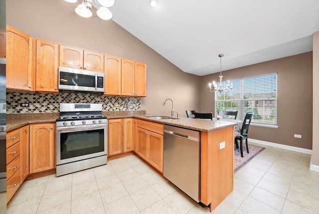 5227 Cobblers Xing Unit 5227, Mchenry, IL 60050 - kitchen featuring stainless steel appliances, a chandelier, a peninsula, backsplash, and vaulted ceiling