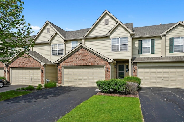 5227 Cobblers Xing Unit 5227, Mchenry, IL 60050 - multi unit property with driveway, brick siding, and a garage