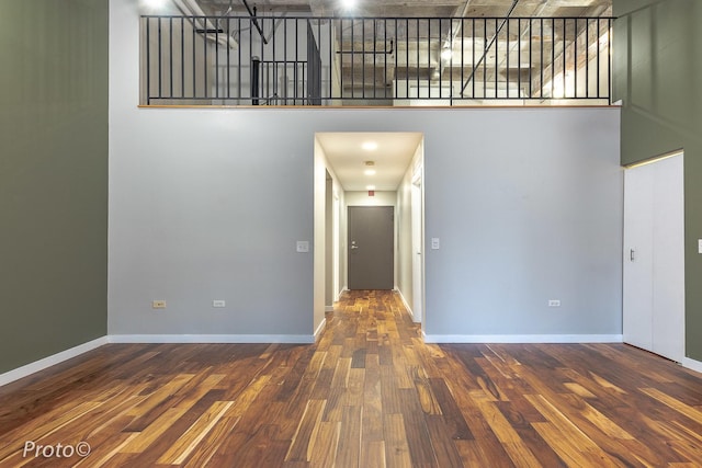 20 N State St Unit 1012, Chicago, IL 60602 - unfurnished living room featuring wood finished floors and a towering ceiling