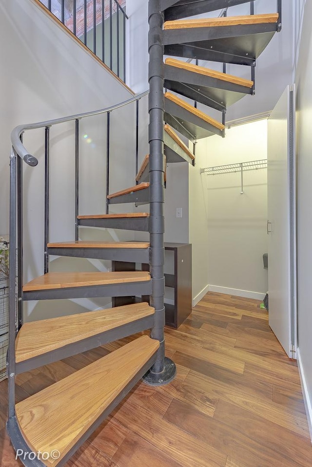 20 N State St Unit 1012, Chicago, IL 60602 - stairway with baseboards and wood finished floors
