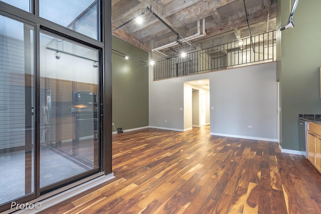 20 N State St Unit 1012, Chicago, IL 60602 - unfurnished room with a towering ceiling and dark wood-style flooring
