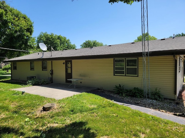 8788 Sheffield Dr, Belvidere, IL 61008 - rear view of house featuring a patio and a lawn
