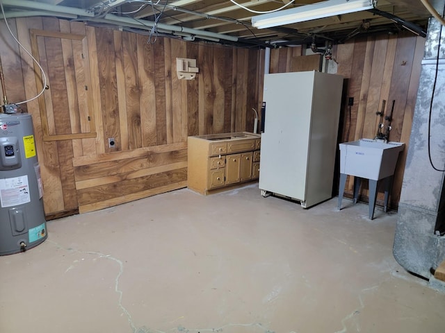 8788 Sheffield Dr, Belvidere, IL 61008 - unfinished below grade area with freestanding refrigerator, electric water heater, and wood walls