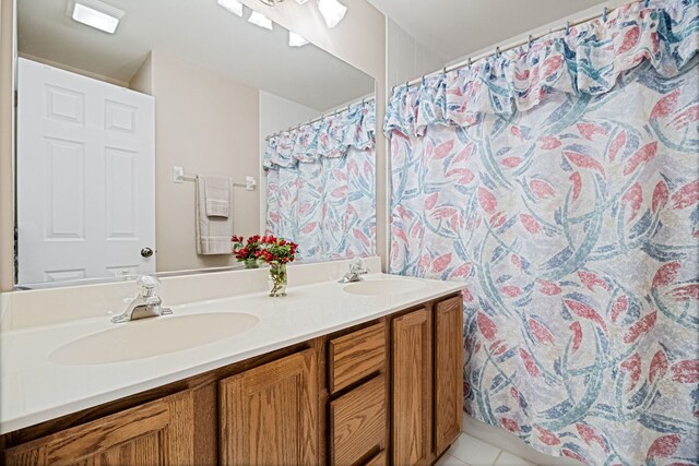 145 Barnes Rd, Elgin, IL 60124 - full bathroom featuring double vanity, a shower with curtain, and tile patterned floors