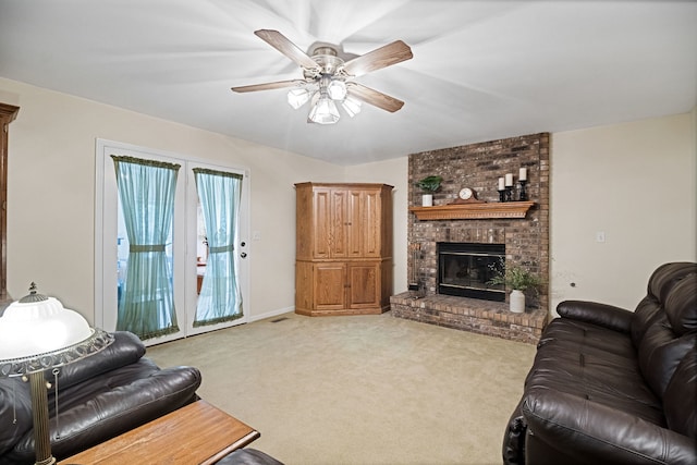 145 Barnes Rd, Elgin, IL 60124 - carpeted living room featuring ceiling fan and a fireplace