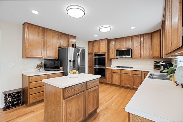 145 Barnes Rd, Elgin, IL 60124 - kitchen with appliances with stainless steel finishes, light wood-style floors, a center island, light countertops, and recessed lighting