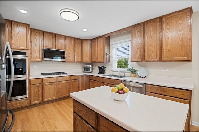 145 Barnes Rd, Elgin, IL 60124 - kitchen with stainless steel appliances, light wood-style floors, brown cabinetry, and recessed lighting