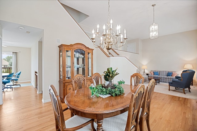 145 Barnes Rd, Elgin, IL 60124 - dining space with light wood-style flooring and a chandelier