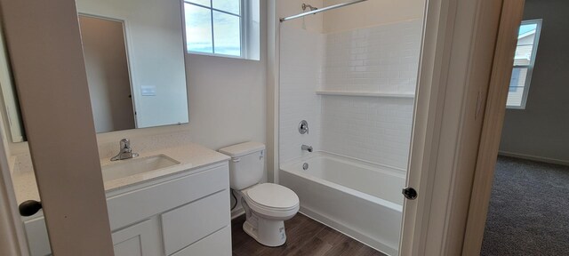 6455 Juniper Dr, Wonder Lake, IL 60097 - bathroom with vanity, washtub / shower combination, and wood finished floors