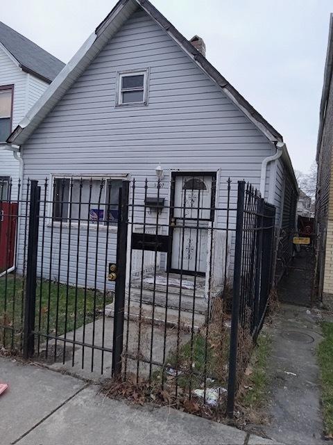 3307 W 37th Pl, Chicago, IL 60632 - view of front of home featuring a gate, a chimney, and a fenced front yard