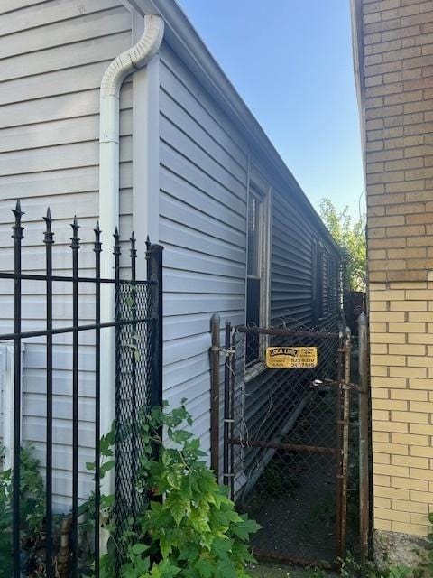 3307 W 37th Pl, Chicago, IL 60632 - view of side of home featuring a gate