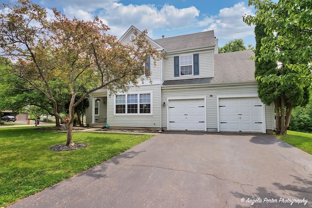 179 Cascade Dr, Crystal Lake, IL 60012 - traditional-style house with asphalt driveway, a front lawn, and roof with shingles