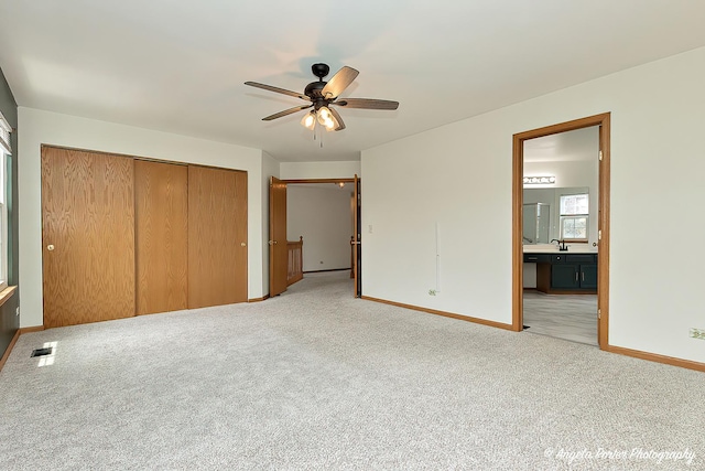 179 Cascade Dr, Crystal Lake, IL 60012 - unfurnished bedroom featuring light colored carpet, a closet, ensuite bath, and ceiling fan
