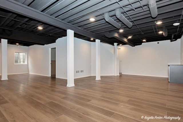 179 Cascade Dr, Crystal Lake, IL 60012 - basement with wood finished floors and baseboards