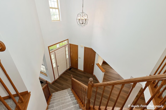 179 Cascade Dr, Crystal Lake, IL 60012 - entryway featuring stairs, a high ceiling, wood finished floors, and a chandelier