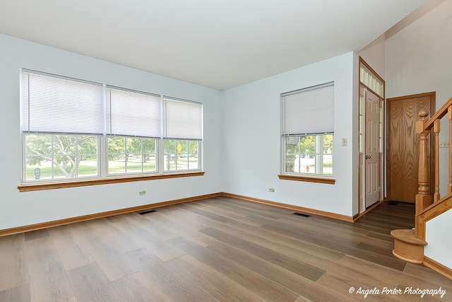 179 Cascade Dr, Crystal Lake, IL 60012 - empty room with wood finished floors and stairs
