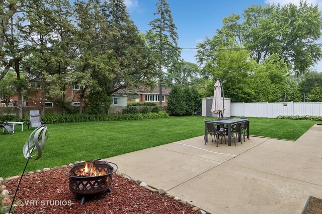 115 S We Go Trl, Mount Prospect, IL 60056 - fenced backyard featuring a patio area, a fire pit, a shed, and outdoor dining space