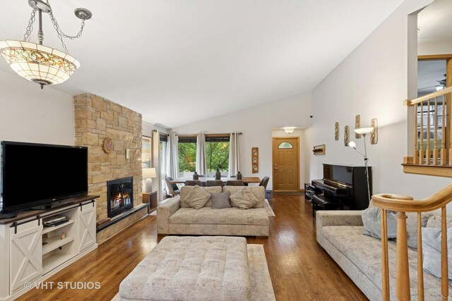 115 S We Go Trl, Mount Prospect, IL 60056 - living area with vaulted ceiling, wood finished floors, and a stone fireplace