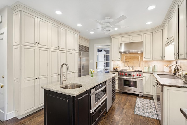 2951 Colfax St, Evanston, IL 60201 - kitchen with premium appliances, under cabinet range hood, a sink, a ceiling fan, and recessed lighting