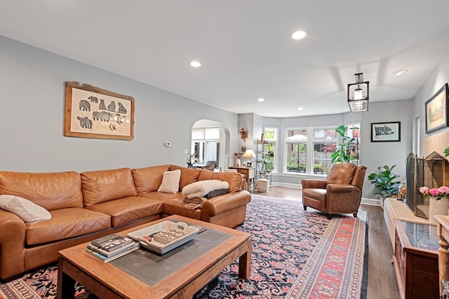 2951 Colfax St, Evanston, IL 60201 - living area featuring arched walkways, recessed lighting, baseboards, and wood finished floors
