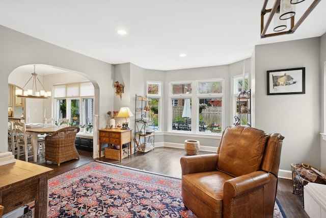 2951 Colfax St, Evanston, IL 60201 - sitting room featuring arched walkways, wood finished floors, healthy amount of natural light, a chandelier, and recessed lighting